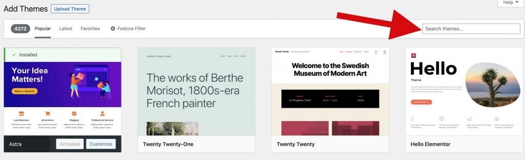 Screenshot of the WordPress Add Themes page with a red arrow pointing to the "Search themes..." box beside the Astra theme