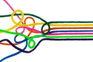 Tangled coloured ropes on the left straightening into neat parallel lines on the right, like testing refining a campaign
